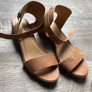 Size 4, strap sandals, about 1/2 heel. Good girls shoe
